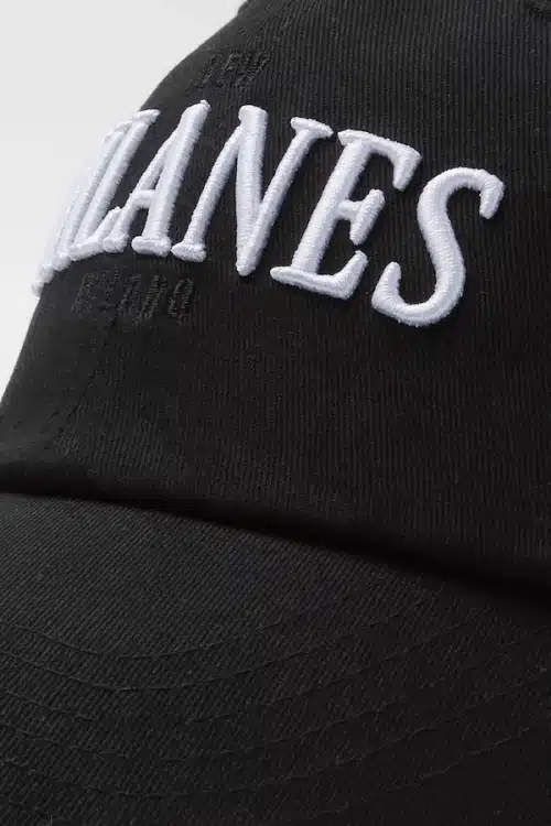 M Signature cap close up view. Black embroidery. New Milanes style.